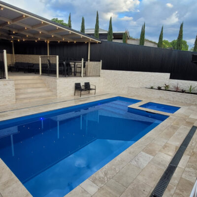 Classic Cream Travertine pool paving and Bookleaf Wall Cladding3